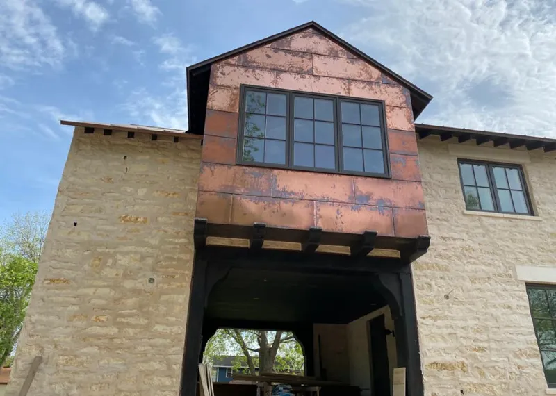 Copper metal panel facade on a stone building for Skylight Installation in East Whiteland